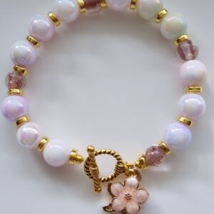 Beaded pearl female bracelet with flower and sea star enamel charm