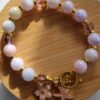 Beaded pearl female bracelet with flower and sea star enamel charm