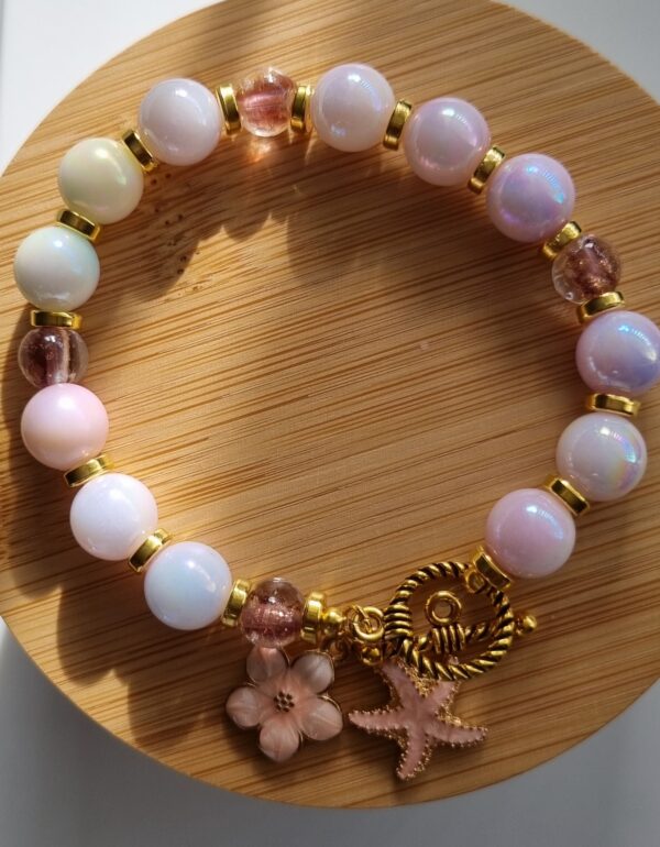 Beaded pearl female bracelet with flower and sea star enamel charm